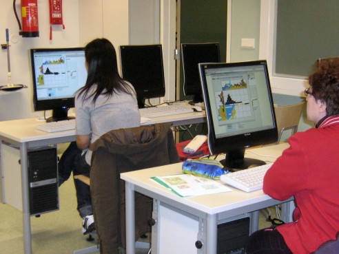 Students solving a Color Pic-a-Pix on their computers at different paces, all are very concentrated
