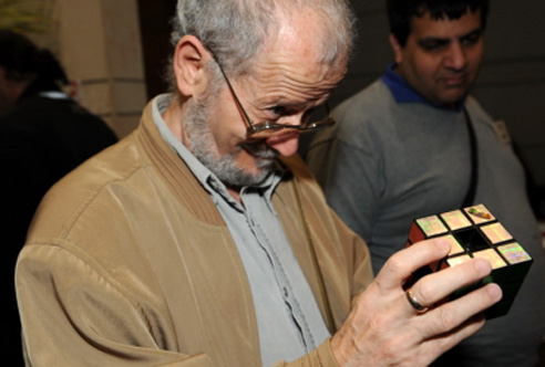 Dan Feldman, a well-known puzzle collector and a former organizer of the conference, examines a variation of Rubik's cube.