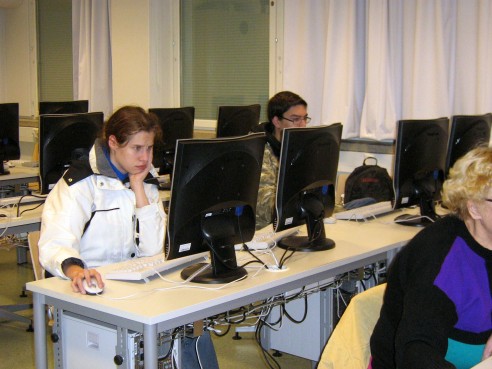 Students solving a Color Pic-a-Pix on their computers at different paces, all are very concentrated