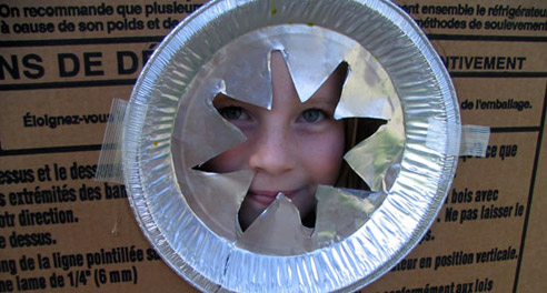 A girl in  card board home which was part of card board city.