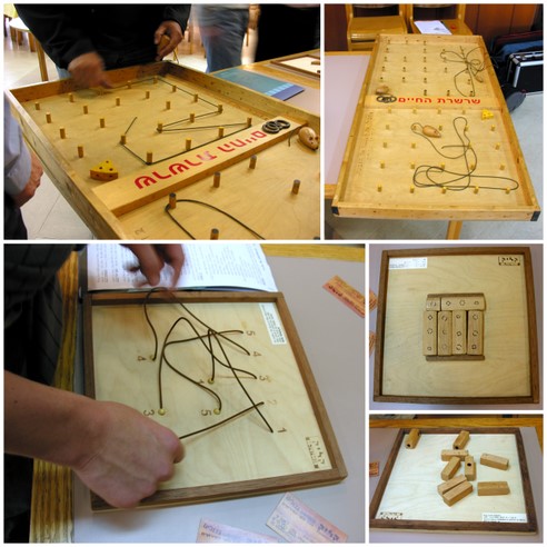 Participant at a workshop tries to solve some topological rope puzzles.